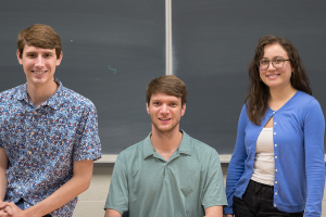 Andrew Roberts, Patrick Lachance and Hannah Skobe smile at the camera.