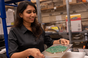 Aleesha Kallil Tharayil adjusts a module for the HGCAL upgrade project.