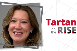 Antonia Simakova smiles at the camera. The text "Tartans on the Rise" is on the side.