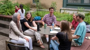 People sitting around a table outdoors